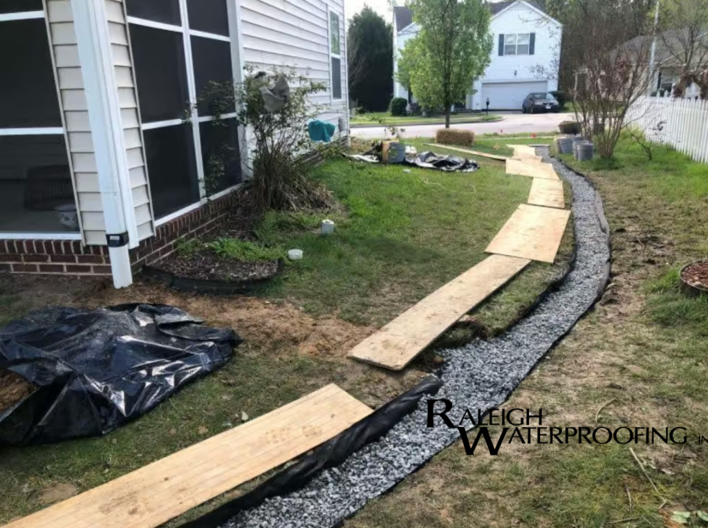 French drain installation in Raleigh NC to stop yard flooding and protect the foundation from water damage